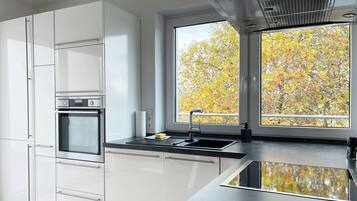 Panoramic Penthouse | Private kitchen | Microwave, oven, stovetop, dishwasher