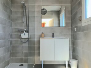Bathtub, hair dryer, towels, soap
