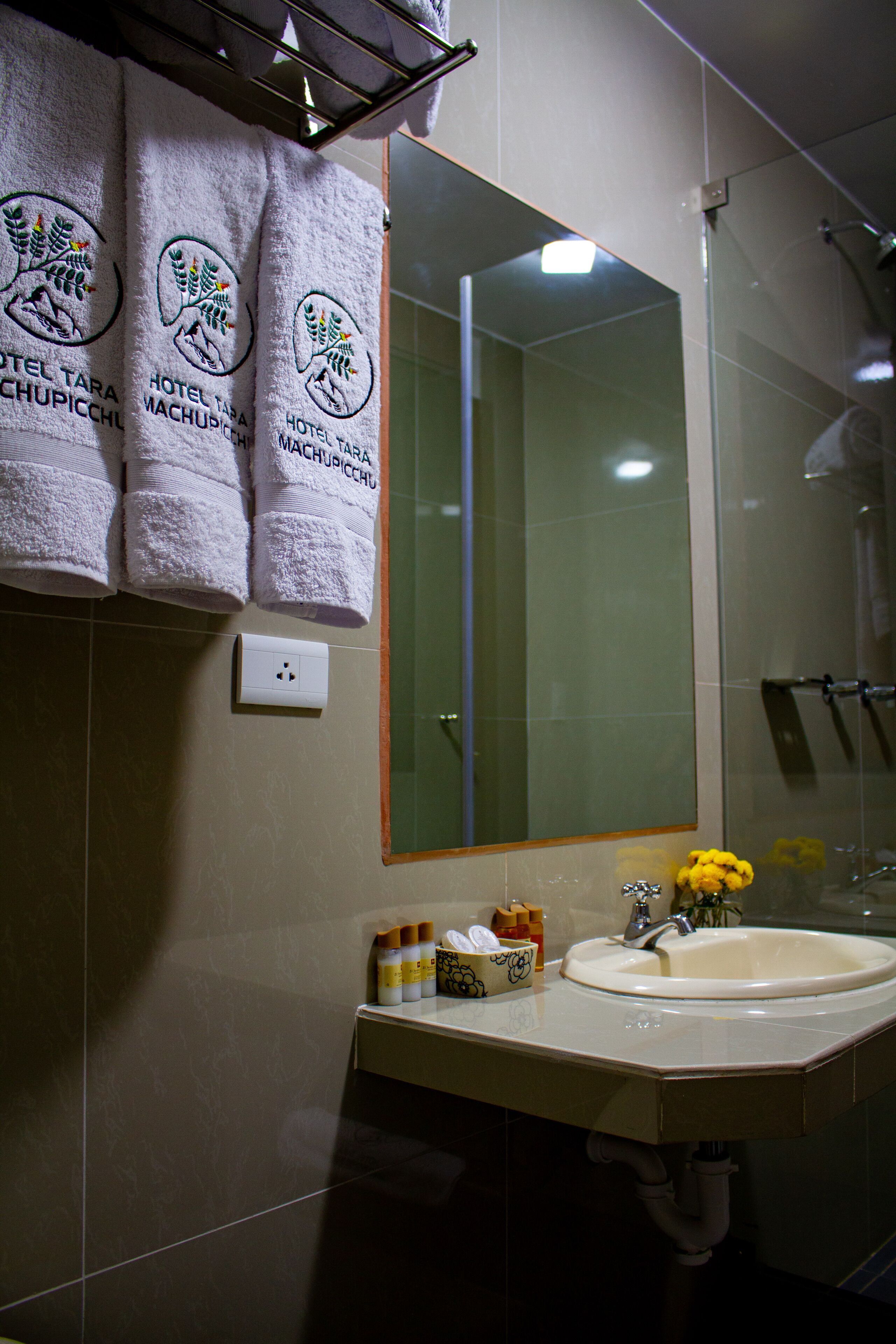 family room | bathroom | shower, rainfall showerhead, hair dryer, towels