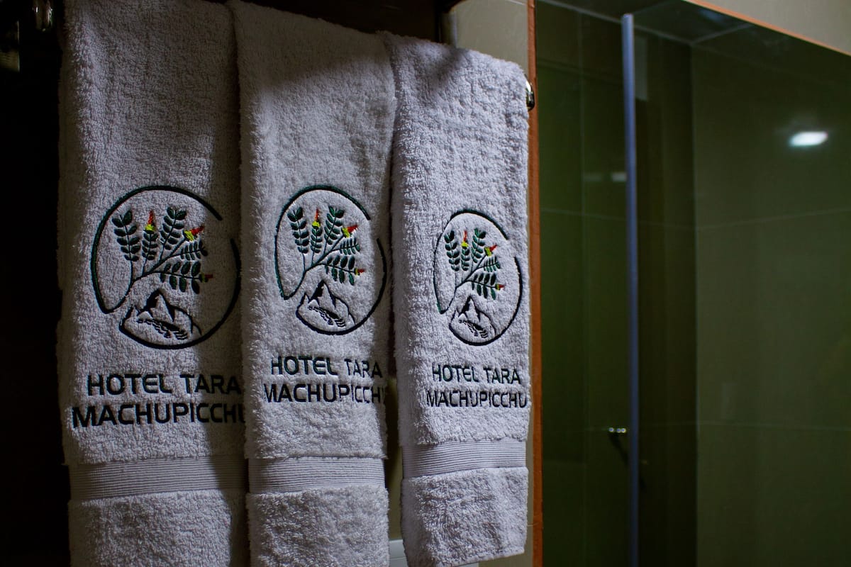 family room | bathroom | shower, rainfall showerhead, hair dryer, towels