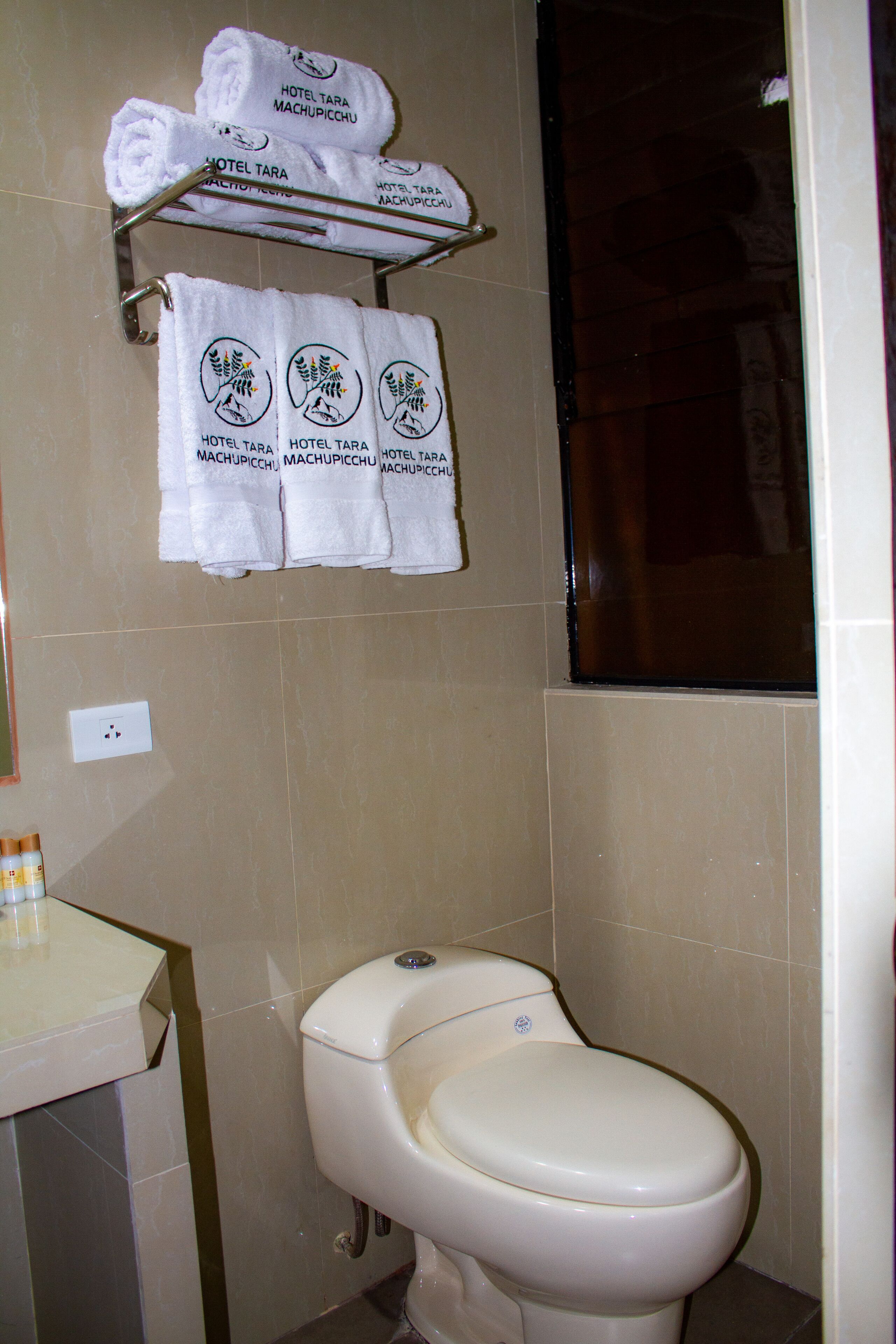 family room | bathroom | shower, rainfall showerhead, hair dryer, towels