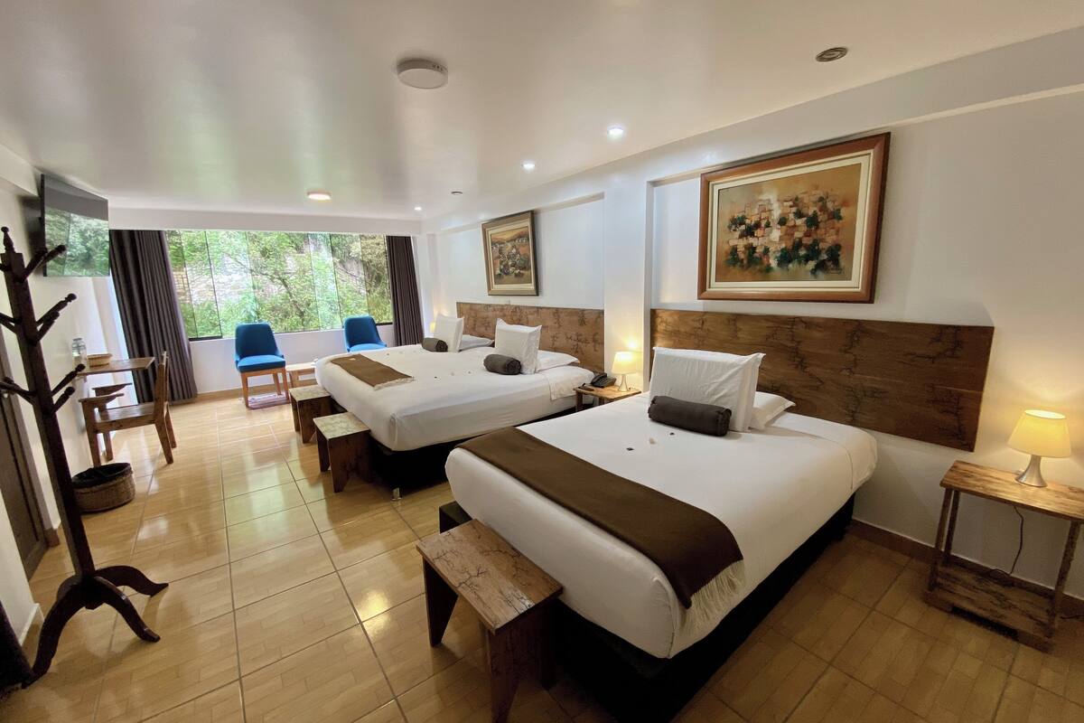 family room | 1 bedroom, pillow-top beds, in-room safe, iron/ironing board