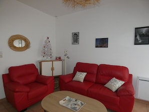 Relax in this stylish living room with a leather sofa, coffee table, and framed artwork.