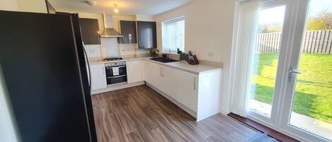 Fridge, oven, stovetop, dining tables