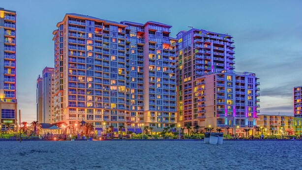A high-rise hotel with multiple balconies and a waterfront view. - Two Bedroom Luxury Suite, Ocean View, Virginia Beach, Virginia (2555337) (Virginia Beach)