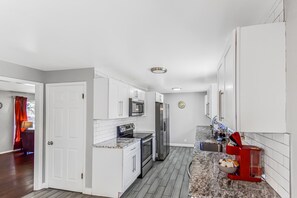 Fridge, microwave, oven, stovetop - Expansive Centennial Home with Spacious Yard & Parking (Centennial)