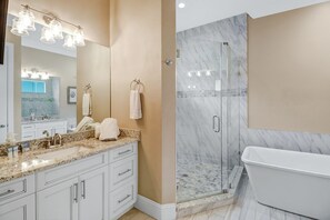 Combined shower/tub, hair dryer, towels, toilet paper