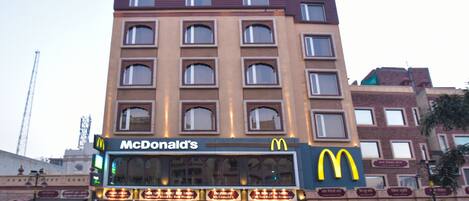 A multi-story building with a McDonald's restaurant on the ground floor.