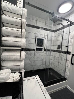 Combined shower/tub, hair dryer, towels, soap