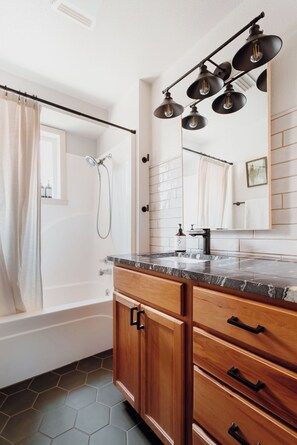 Bathtub, hair dryer, towels, soap