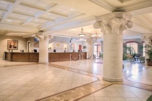 Experience the grandeur of our lobby, featuring high ceilings, ornate columns, and a polished floor.