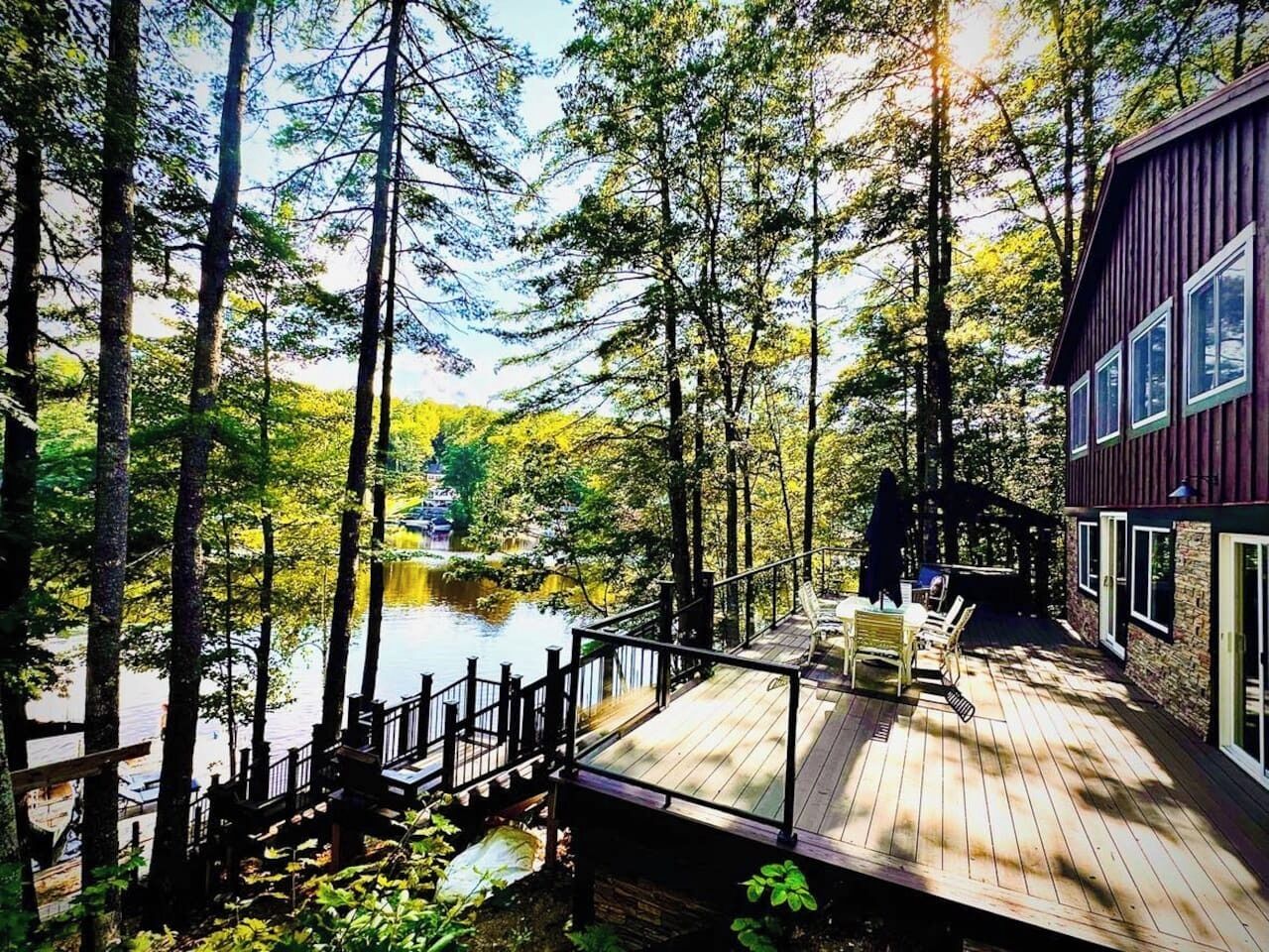Huge deck, great sandy beach with fire pit, huge dock with sunbathing loungers and stunning views!!