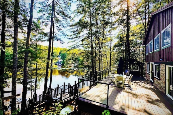 Huge deck, great sandy beach with fire pit, huge dock with sunbathing loungers and stunning views!!
