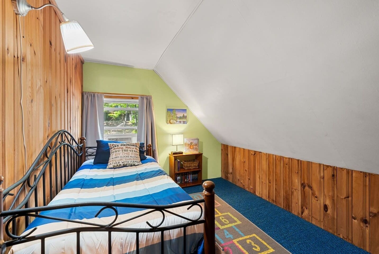 loft bedroom with trundle bed (another twin size bed pulls out from under); sleeps 2. Room darkeing drapes.
