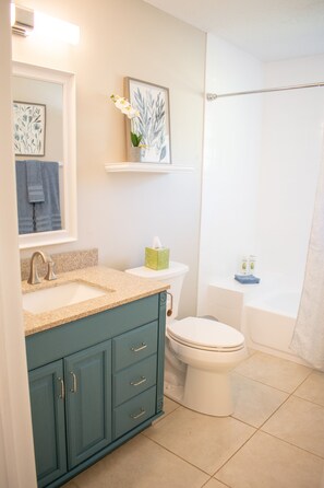 Combined shower/tub, hair dryer, towels, soap