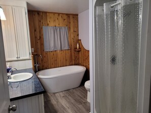 Bathtub, hair dryer, towels, soap