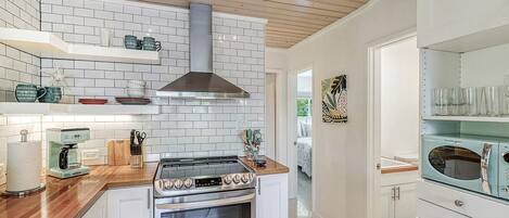 Microwave, dishwasher, coffee/tea maker, cookware/dishes/utensils