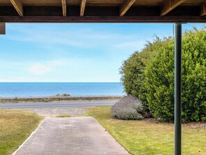 A paved pathway leading to a beach with a clear view of the ocean. - Esplanade 3BR Holiday Home with Beautiful Ocean Views (Encounter Bay)