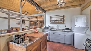 A kitchen with wooden beams, a countertop with coffee maker, toaster, and sink. - Bloomington Cabin: 4 Mi to Indiana University (Bloomington)