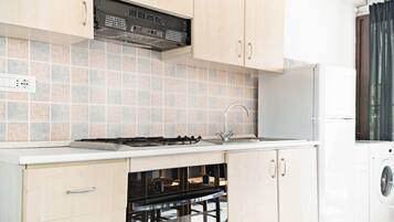 Een koelkast, een oven, een kookplaat