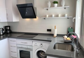 Fridge, microwave, oven, stovetop - Lovely Modern Apartment on the Front Line with Sea View, Wi-Fi, A/C & Balcony (Nerja)