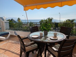 Outdoor dining - 'Sunny Apartment Front Line Burriana' Near the Beach with Sea View, Wi-Fi, A/C & Balcony (Nerja)
