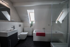 Bathtub, hair dryer, towels, soap