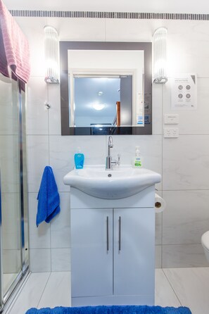 Shower, hair dryer, towels, soap