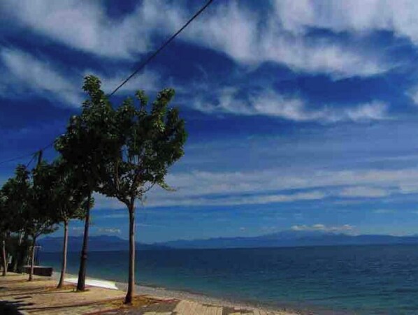 Enjoy breathtaking views of the ocean and surrounding landscape from this serene beachside retreat.