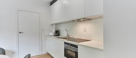 Standard Apartment | Private kitchen | Fridge, coffee/tea maker, electric kettle, dining tables
