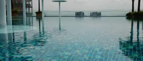 Outdoor pool, open 9:00 AM to 10:00 PM, sun loungers