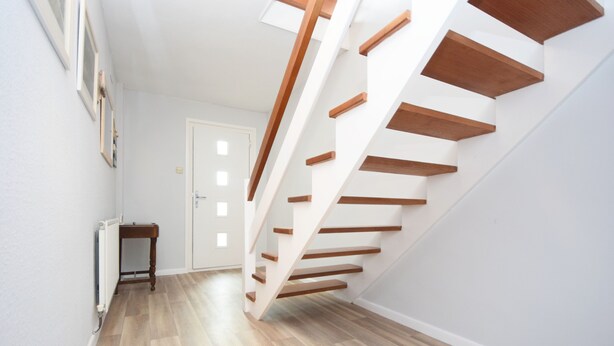 A modern staircase with wooden steps and white walls. - Sea Breeze, Selsey -  a town house that sleeps 6 guests  in 3 bedrooms (Chichester)