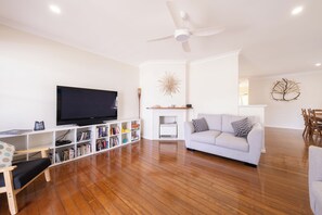 Flat-screen TV, DVD player, books