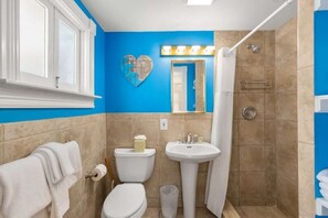 Shower, hair dryer, towels, shampoo