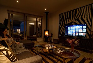 Luxury Apartment | Living area | 42-inch Smart TV with satellite channels, TV, MP3 dock