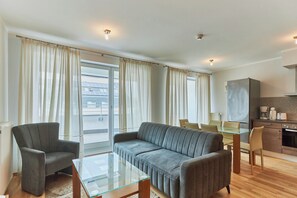 Family Apartment | Living area | 40-inch flat-screen TV with digital channels, TV