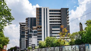 A modern multi-story building with balconies, located at Oxford Road. - Trendy Studio Apartment Centrally Located (Johannesburg)