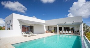 Outdoor pool, a heated pool, sun loungers