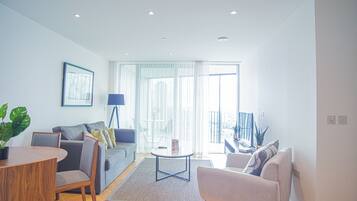 Apartment, 1 Queen Bed | Living room | 30-inch TV with cable channels
