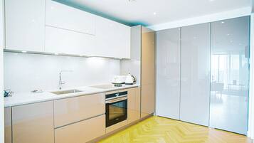 Apartment, 1 Queen Bed | Private kitchen | Fridge, microwave, oven, stovetop