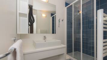 Shower, towels, soap, shampoo
