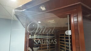 A glass door with the text "Vital SAUNAS" and a sign indicating "Dry sauna" with a note to "Please do not use water." - Strawberry Hill A Deluxe Retreat, Close to Village 1.5 mi to Acadia (Bar Harbor)