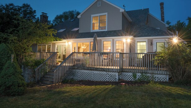 A two-story house with a covered porch, a staircase, and a chimney. - Strawberry Hill A Deluxe Retreat, Close to Village 1.5 mi to Acadia (Bar Harbor)