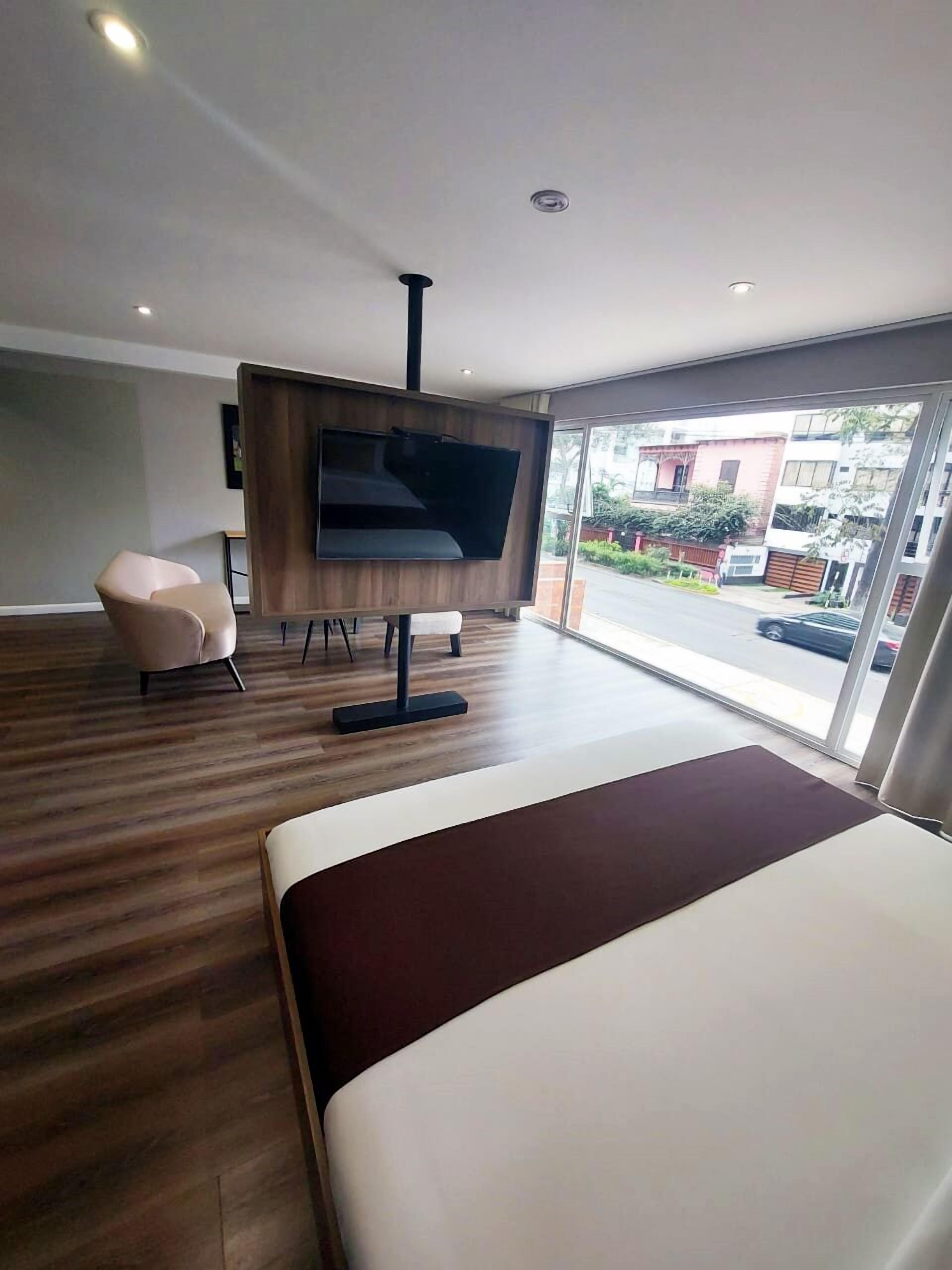 deluxe studio suite | premium bedding, down duvets, in-room safe, desk