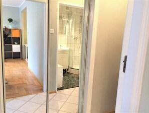 Shower, hair dryer, towels, toilet paper