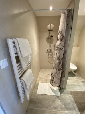 Shower, hair dryer, towels, soap