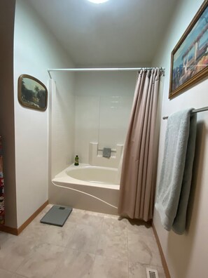 Combined shower/tub, hair dryer, towels, soap