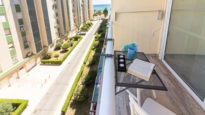 A balcony with a table, a chair, and a book. - SW Mendoza 20 (Málaga)