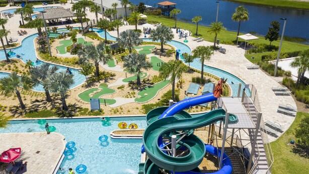 A resort with a large pool, water slides, and a golf course. - 4873- Great Family Home near Disney, private pool, Storey Lake (Pet Friendly) (Kissimmee)