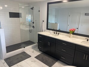 Bathtub, hair dryer, towels, soap